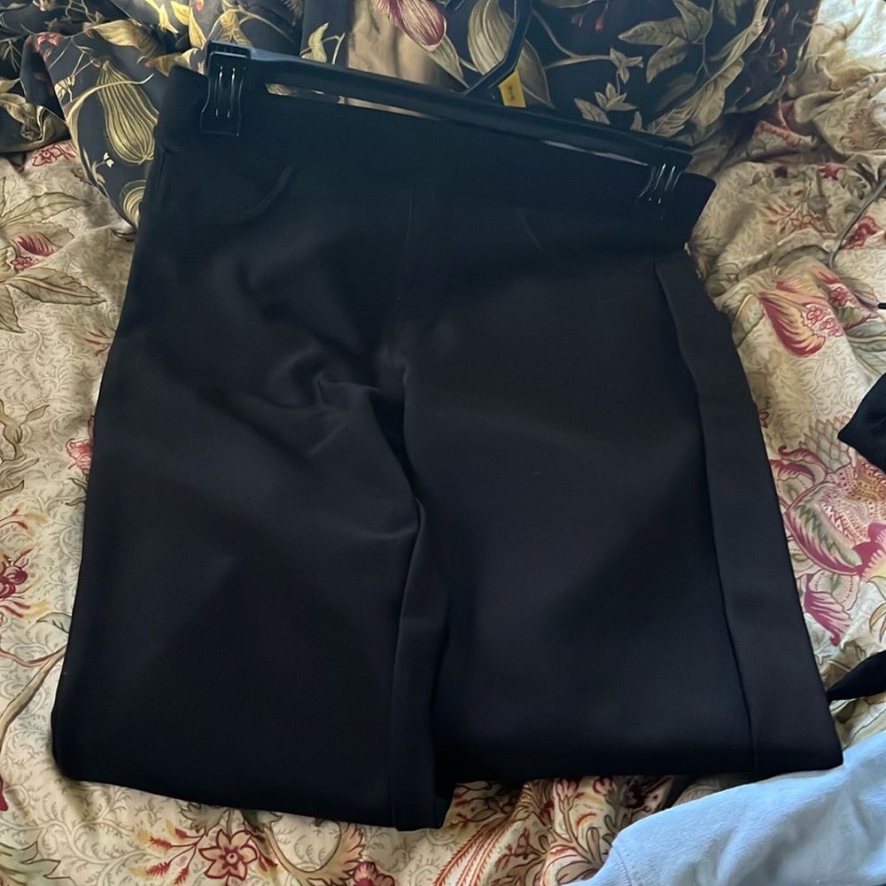 These are black legging like pants, they are medium. Front pockets not real.